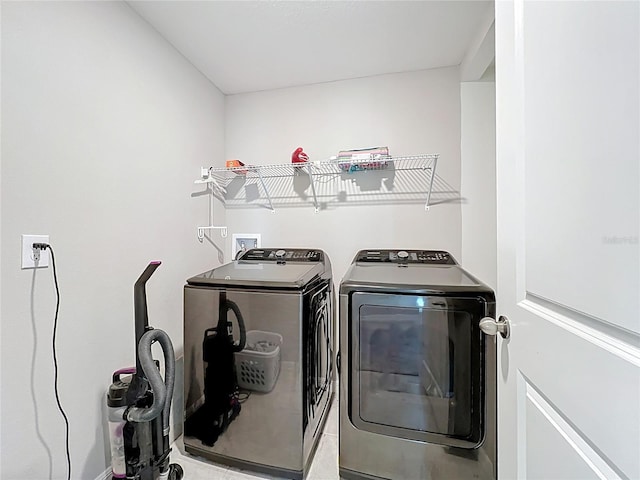 laundry area featuring washer and clothes dryer and laundry area