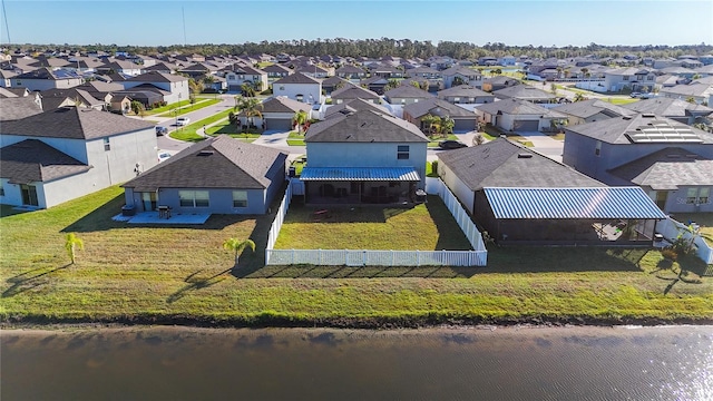 birds eye view of property with a residential view