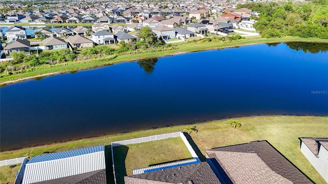 birds eye view of property with a residential view and a water view