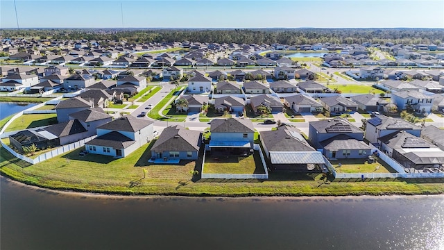 aerial view with a residential view and a water view