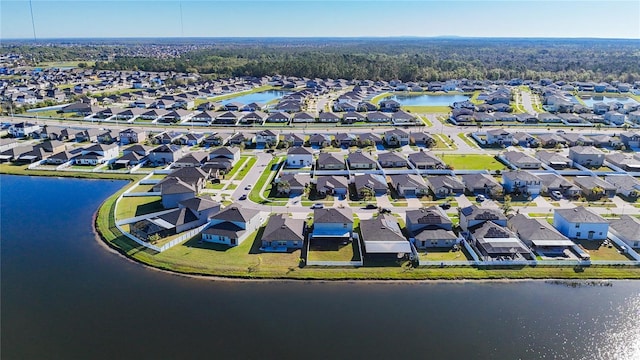 aerial view featuring a residential view and a water view