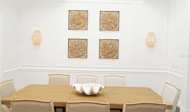 dining space with a decorative wall