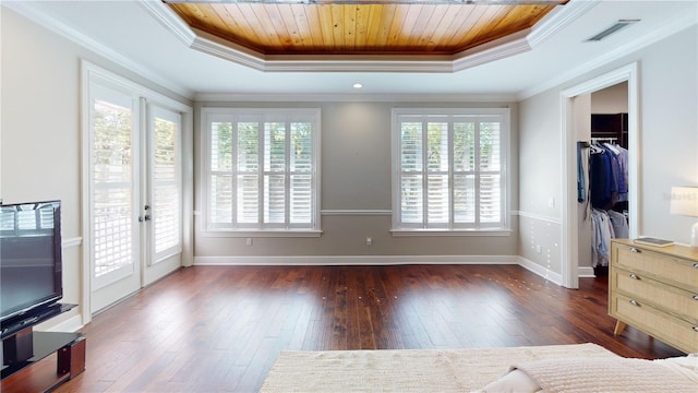 bedroom featuring wood ceiling, a raised ceiling, and wood finished floors