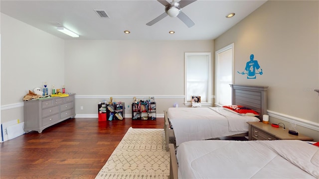 bedroom with recessed lighting, wood finished floors, visible vents, and baseboards