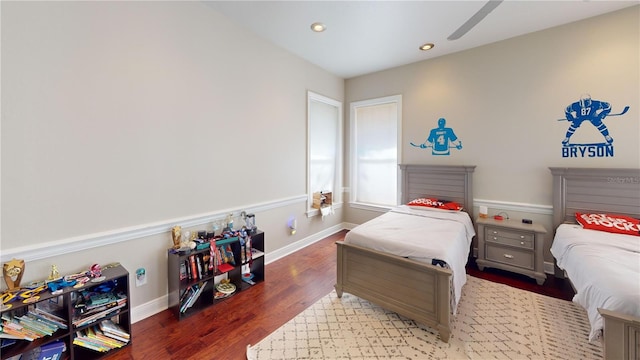 bedroom with recessed lighting, baseboards, and wood finished floors