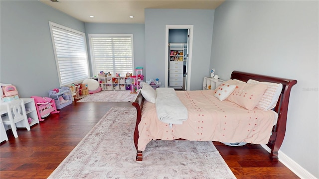 bedroom featuring recessed lighting, baseboards, and wood finished floors