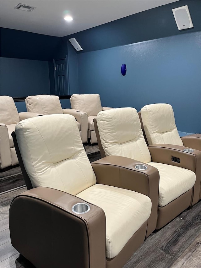 home theater room with recessed lighting, visible vents, and wood finished floors