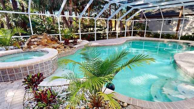 outdoor pool with glass enclosure and an in ground hot tub