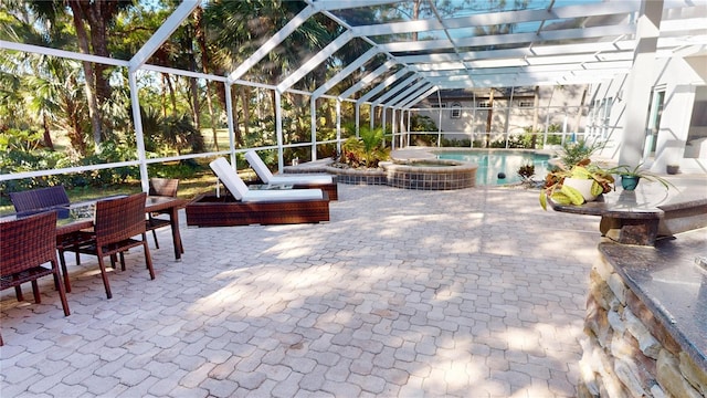 view of patio / terrace with glass enclosure, an in ground hot tub, and an outdoor pool