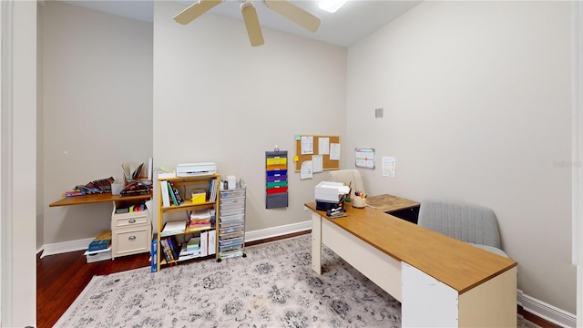 office area featuring ceiling fan, baseboards, and wood finished floors