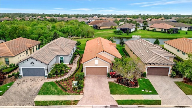 aerial view featuring a residential view and a water view