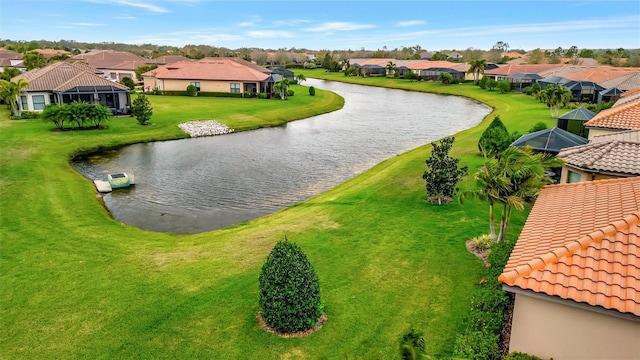 birds eye view of property featuring a residential view and a water view