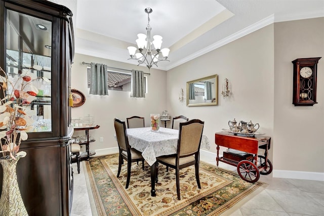 dining room featuring light tile patterned floors, a notable chandelier, baseboards, and a tray ceiling