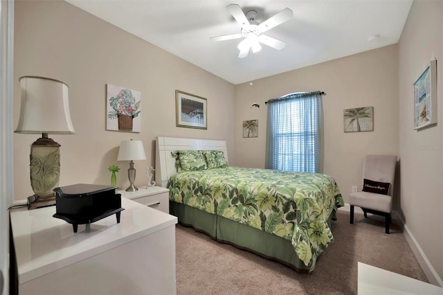 bedroom featuring light colored carpet, baseboards, and ceiling fan