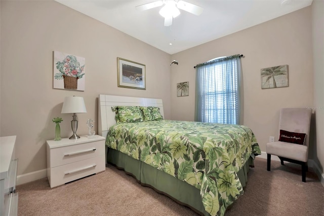 bedroom featuring light carpet, ceiling fan, and baseboards
