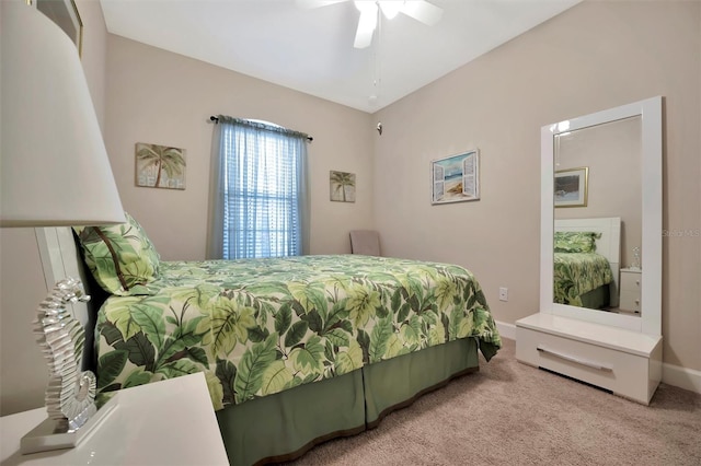 carpeted bedroom featuring ceiling fan and baseboards