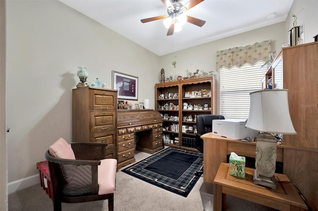 office featuring baseboards, ceiling fan, and carpet flooring