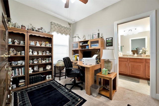 office with light carpet and ceiling fan