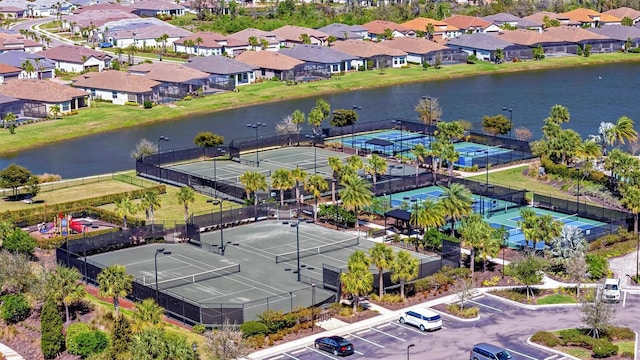 bird's eye view featuring a residential view and a water view
