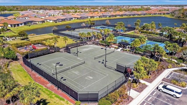 bird's eye view featuring a residential view and a water view