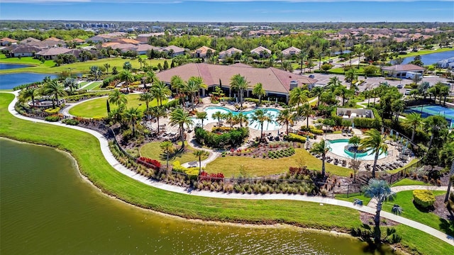 drone / aerial view featuring a residential view and a water view