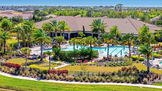 pool featuring a lawn, fence private yard, and a patio area