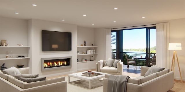 living area featuring recessed lighting, built in shelves, a lit fireplace, and wood finished floors