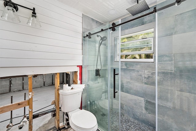 full bathroom with toilet and a shower stall