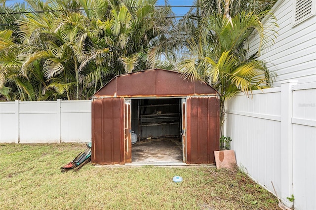 view of shed featuring a fenced backyard