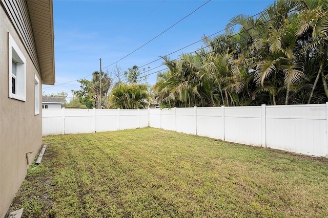 view of yard with a fenced backyard