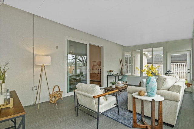 living area featuring a sunroom