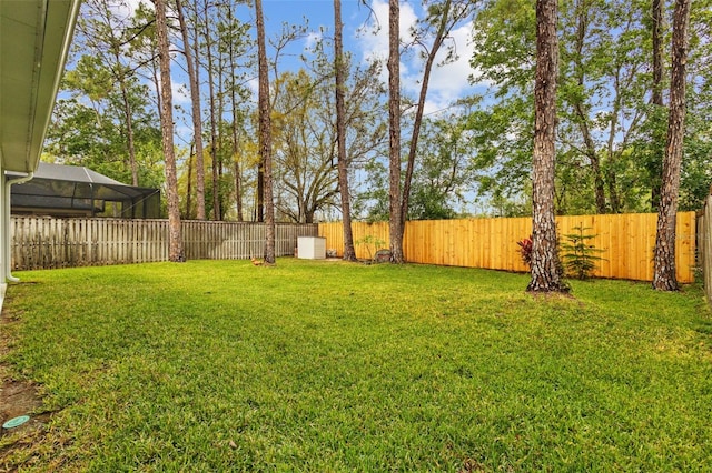 view of yard with a fenced backyard