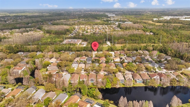 birds eye view of property with a residential view and a water view