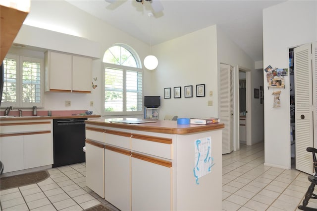 kitchen featuring light tile patterned flooring, black dishwasher, and vaulted ceiling