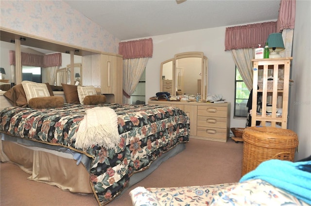 bedroom featuring carpet and wallpapered walls