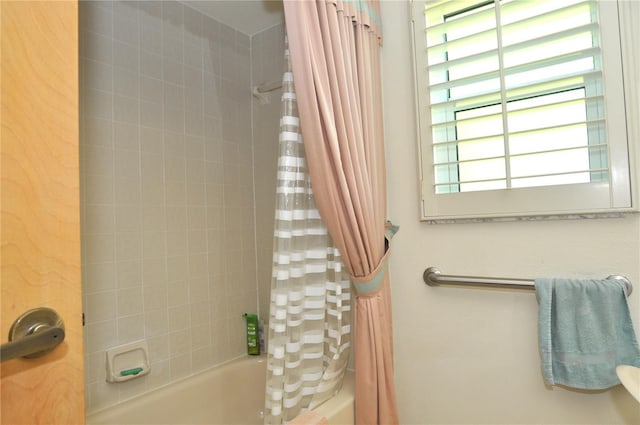 full bathroom featuring shower / tub combo with curtain