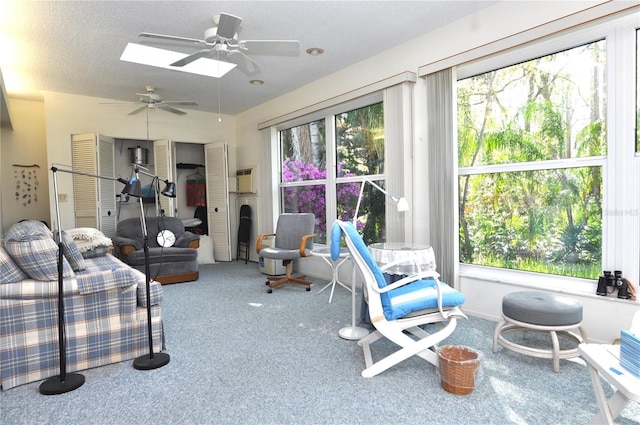 carpeted bedroom with a textured ceiling and a skylight