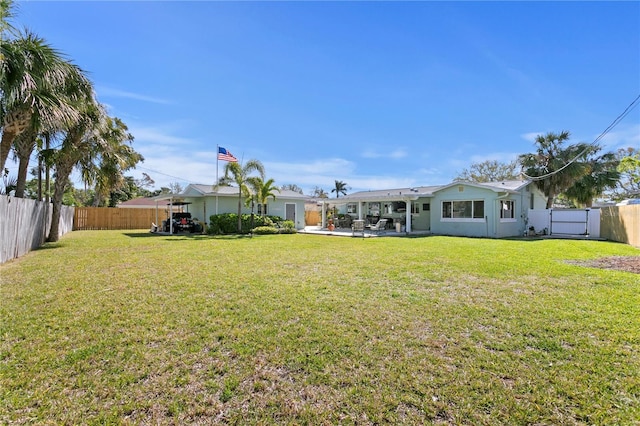 view of yard featuring a patio area and a fenced backyard