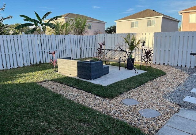 view of yard with a patio area and a fenced backyard