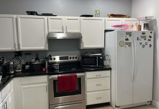 kitchen featuring freestanding refrigerator, stainless steel electric range, white cabinets, exhaust hood, and black microwave