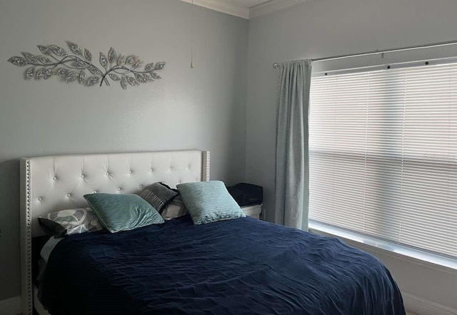 bedroom with crown molding