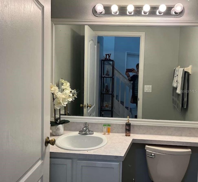 bathroom with vanity and toilet