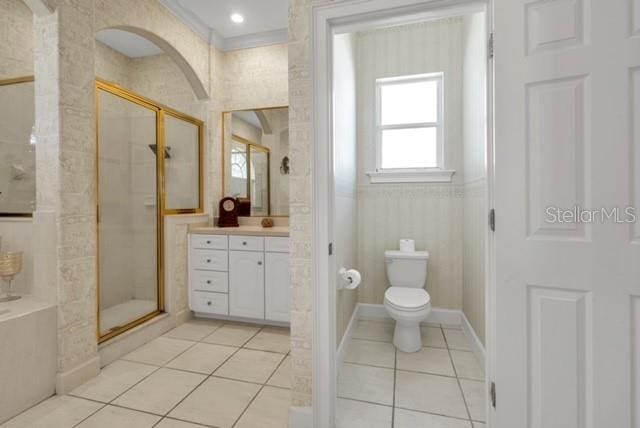 bathroom with vanity, tile patterned flooring, a shower stall, toilet, and a bathtub