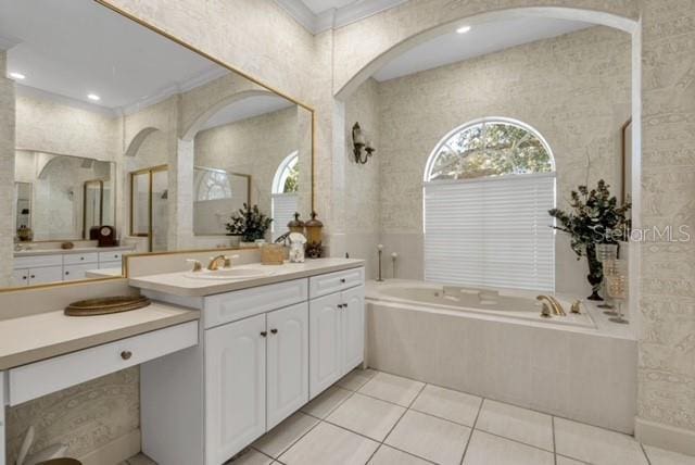 full bath with vanity, tile patterned floors, a bath, and ornamental molding