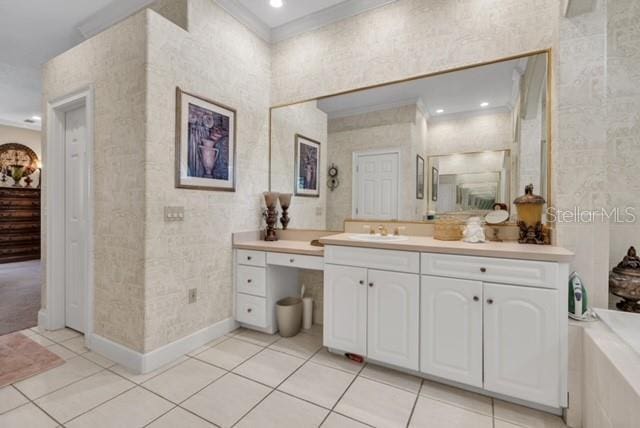 bathroom with crown molding, baseboards, recessed lighting, tile patterned floors, and vanity