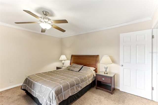 bedroom with light colored carpet, ceiling fan, baseboards, and ornamental molding