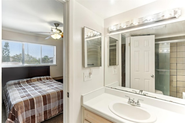 bathroom with vanity, crown molding, an enclosed shower, and a ceiling fan