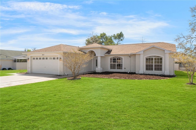 mediterranean / spanish-style home with a shingled roof, concrete driveway, a front yard, stucco siding, and a garage