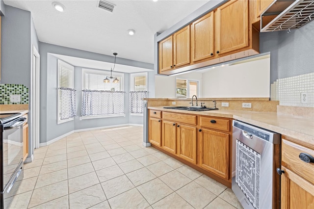 kitchen featuring visible vents, a sink, light countertops, range with electric stovetop, and stainless steel dishwasher