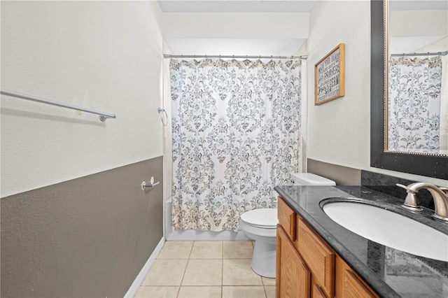 full bathroom with tile patterned flooring, toilet, vanity, and shower / bath combo